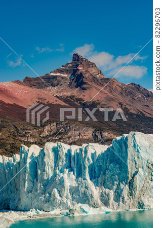 Famous Perito Moreno glacier and mountain turquoise lagoon with austral forests at golden Autumn in Patagonia, South America, Argentina 82296703