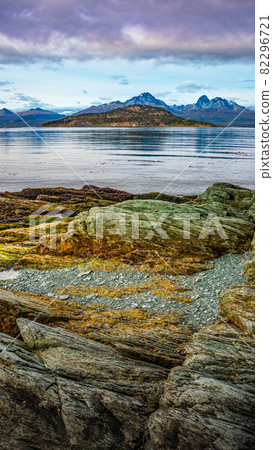 Beautiful sunset at Ensenada Zaratiegui Bay in Tierra del Fuego National Park, near Ushuaia and Beagle Channel, with geological mineral deposits, Patagonia, Argentina, early Autumn. 82296721