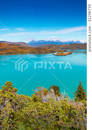 View over mountain turquoise lagoon in Torres del Paine National Park at sunny day and blue sky, Patagonia, Chile, details 82296739