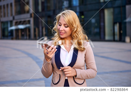 Businesswoman is talking by phone using video call. Businesswoman is talking by phone using video call. 82298864