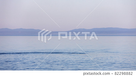 Blue surface of the water of Lake Baikal on a morning summer day. 82298882