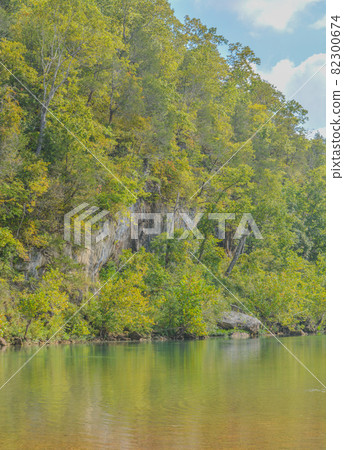 The Current River flowing through the wilderness of Ozark National Scenic Riverway in Missouri 82300674