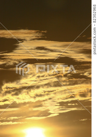 a Beautiful sunset sky above clouds with dramatic light. a Beautiful sunset sky above clouds with dramatic light. 82302968