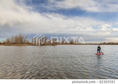 stand up paddling in fall 82303581