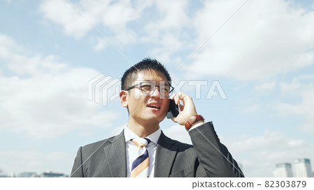Businessmen talking on a smartphone Businessmen talking on a smartphone 82303879