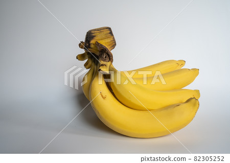 Several ripe bananas, some of which have been carved Several ripe bananas, some of which have been carved 82305252