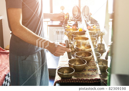 Tibetan singing bowls in sound therapy in spa center 82309198