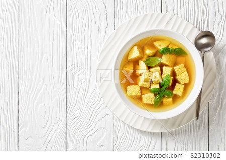 soup of chicken broth with parmesan egg dumplings soup of chicken broth with parmesan egg dumplings 82310302
