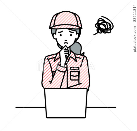 A female worker who is in trouble sitting at a desk and opening a PC 82311814