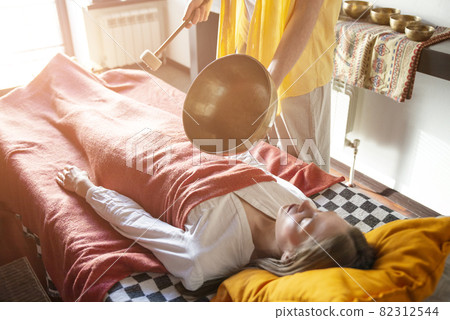 Tibetan singing bowls in sound therapy in spa center 82312544