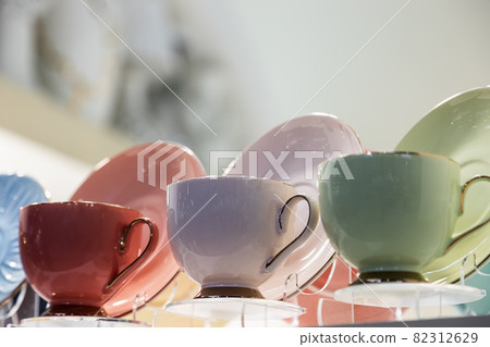different-colored porcelain cups are on the counter different-colored porcelain cups are on the counter 82312629