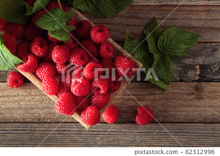 Fresh raspberries with leaves. Fresh raspberries with leaves. 82312996