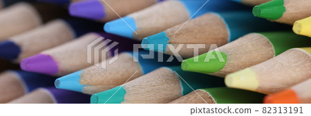 Multicolored wooden pencils with a sharp point closeup 82313191