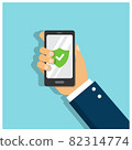 A man's hand holds a phone protected by a strong password and a green sign with a check mark on the screen  82314774