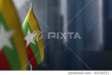 Small flags of Myanmar on a blurry background of the city Small flags of Myanmar on a blurry background of the city 82316511