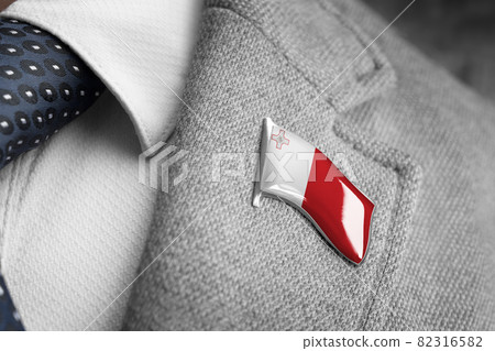 Metal badge with the flag of Malta on a suit lapel Metal badge with the flag of Malta on a suit lapel 82316582