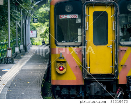 Lingjiao,Taiwan - September 20,2021: Train of Pingxi Railway Line traveling on September 20,2021 in Lingjiao, New Taipei City, Taiwan Lingjiao,Taiwan - September 20,2021: Train of Pingxi Railway Line traveling on September 20,2021 in Lingjiao, New Taipei City, Taiwan 82319473