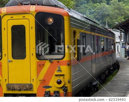 Lingjiao,Taiwan - September 20,2021: Train of Pingxi Railway Line traveling on September 20,2021 in Lingjiao, New Taipei City, Taiwan Lingjiao,Taiwan - September 20,2021: Train of Pingxi Railway Line traveling on September 20,2021 in Lingjiao, New Taipei City, Taiwan 82319491