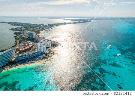 Aerial panoramic view of Cancun beach and city hotel zone in Mexico. Caribbean coast landscape of Mexican resort with beach Playa Caracol and Kukulcan road. Riviera Maya in Quintana roo region on 82321412