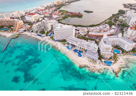 Aerial panoramic view of Cancun beach and city hotel zone in Mexico. Caribbean coast landscape of Mexican resort with beach Playa Caracol and Kukulcan road. Riviera Maya in Quintana roo region on 82321436