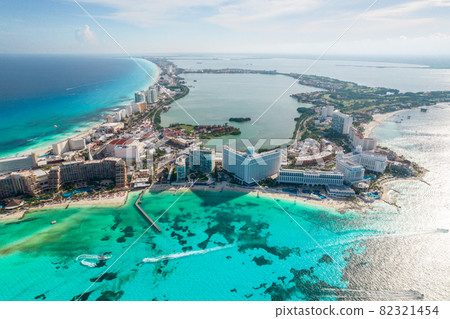 Aerial panoramic view of Cancun beach and city hotel zone in Mexico. Caribbean coast landscape of Mexican resort with beach Playa Caracol and Kukulcan road. Riviera Maya in Quintana roo region on 82321454