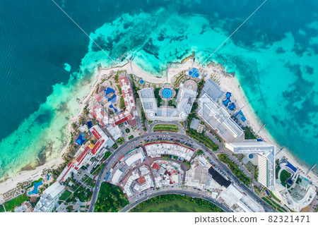 Aerial top view of Cancun beach and city hotel zone in Mexico. Caribbean coast landscape of Mexican resort with beach Playa Caracol and Kukulcan road. Riviera Maya in Quintana roo region on Yucatan 82321471