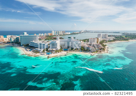 Aerial panoramic view of Cancun beach and city hotel zone in Mexico. Caribbean coast landscape of Mexican resort with beach Playa Caracol and Kukulcan road. Riviera Maya in Quintana roo region on 82321495