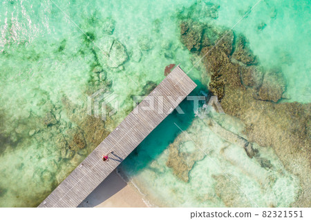 Aerial top view of wooden pier at sunny summer day in Cancun, Mexico, top view. Summertime in Caribbean 82321551
