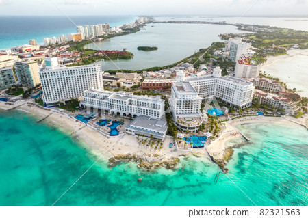 Aerial panoramic view of Cancun beach and city hotel zone in Mexico. Caribbean coast landscape of Mexican resort with beach Playa Caracol and Kukulcan road. Riviera Maya in Quintana roo region on 82321563