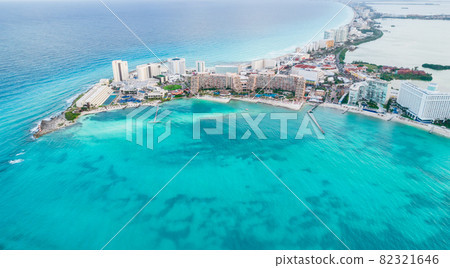 Aerial panoramic view of Cancun beach and city hotel zone in Mexico. Caribbean coast landscape of Mexican resort with beach Playa Caracol and Kukulcan road. Riviera Maya in Quintana roo region on 82321646