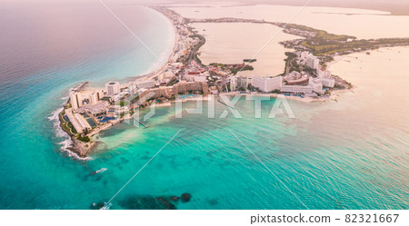 Aerial panoramic view of Cancun beach and city hotel zone in Mexico. Caribbean coast landscape of Mexican resort with beach Playa Caracol and Kukulcan road. Riviera Maya in Quintana roo region on Aerial panoramic view of Cancun beach and city hotel zone in Mexico. Caribbean coast landscape of Mexican resort with beach Playa Caracol and Kukulcan road. Riviera Maya in Quintana roo region on 82321667