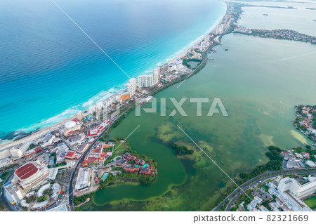 Aerial panoramic view of Cancun beach and city hotel zone in Mexico. Caribbean coast landscape of Mexican resort with beach Playa Caracol and Kukulcan road. Riviera Maya in Quintana roo region on 82321669