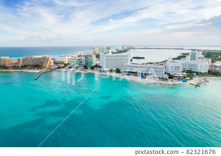 Aerial panoramic view of Cancun beach and city hotel zone in Mexico. Caribbean coast landscape of Mexican resort with beach Playa Caracol and Kukulcan road. Riviera Maya in Quintana roo region on 82321676