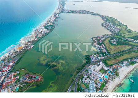 Aerial panoramic view of Cancun beach and city hotel zone in Mexico. Caribbean coast landscape of Mexican resort with beach Playa Caracol and Kukulcan road. Riviera Maya in Quintana roo region on 82321681