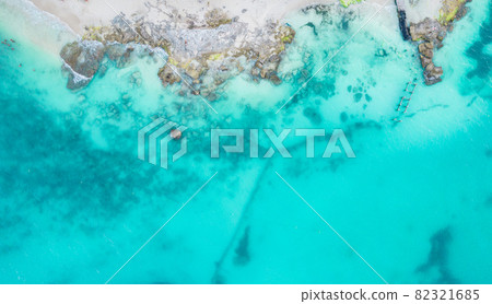 Aerial view of sandy beach and ocean with small waves in Cancun, Mexico. Top view from drone. Playa Caracol of Riviera Maya in Quintana roo region on the Yucatan Peninsula 82321685