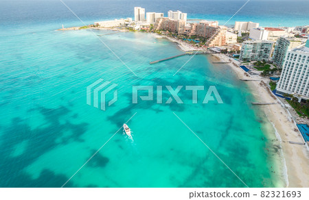 Aerial panoramic view of Cancun beach and city hotel zone in Mexico. Caribbean coast landscape of Mexican resort with beach Playa Caracol and Kukulcan road. Riviera Maya in Quintana roo region on 82321693
