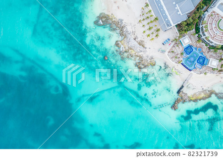 Aerial view of sandy beach and ocean with small waves in Cancun, Mexico. Top view from drone. Playa Caracol of Riviera Maya in Quintana roo region on the Yucatan Peninsula 82321739