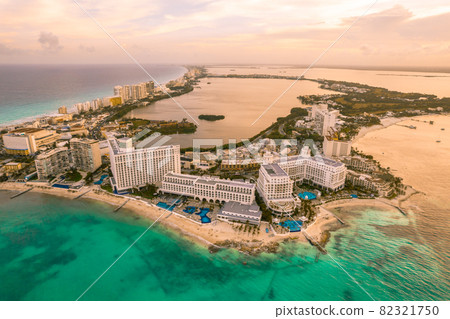 Aerial panoramic view of Cancun beach and city hotel zone in Mexico at sunset. Caribbean coast landscape of Mexican resort with beach Playa Caracol and Kukulcan road. Riviera Maya in Quintana roo 82321750