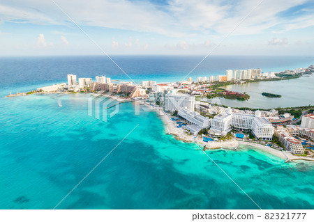 Aerial panoramic view of Cancun beach and city hotel zone in Mexico. Caribbean coast landscape of Mexican resort with beach Playa Caracol and Kukulcan road. Riviera Maya in Quintana roo region on 82321777
