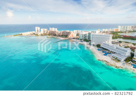 Aerial panoramic view of Cancun beach and city hotel zone in Mexico. Caribbean coast landscape of Mexican resort with beach Playa Caracol and Kukulcan road. Riviera Maya in Quintana roo region on 82321792