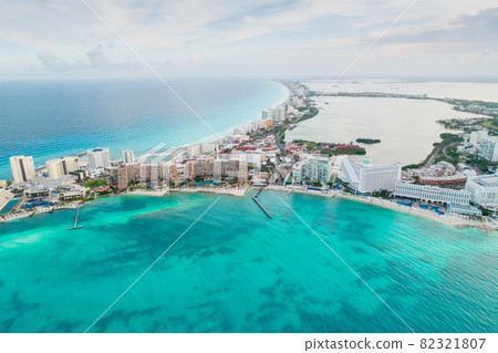 Aerial panoramic view of Cancun beach and city hotel zone in Mexico. Caribbean coast landscape of Mexican resort with beach Playa Caracol and Kukulcan road. Riviera Maya in Quintana roo region on 82321807