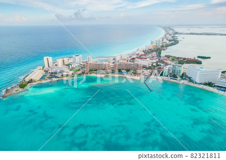Aerial panoramic view of Cancun beach and city hotel zone in Mexico. Caribbean coast landscape of Mexican resort with beach Playa Caracol and Kukulcan road. Riviera Maya in Quintana roo region on 82321811