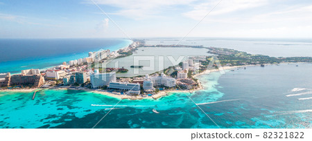 Aerial panoramic view of Cancun beach and city hotel zone in Mexico. Caribbean coast landscape of Mexican resort with beach Playa Caracol and Kukulcan road. Riviera Maya in Quintana roo region on 82321822