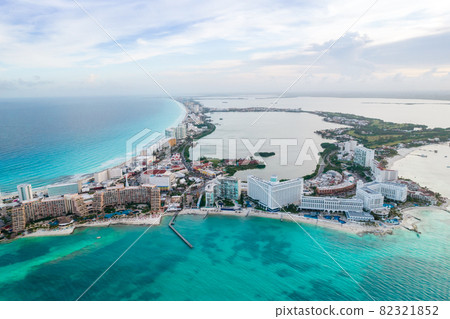 Aerial panoramic view of Cancun beach and hotel zone in Mexico. Caribbean coast landscape of Mexican resort. Riviera Maya in Quintana roo region on Yucatan Peninsula 82321852
