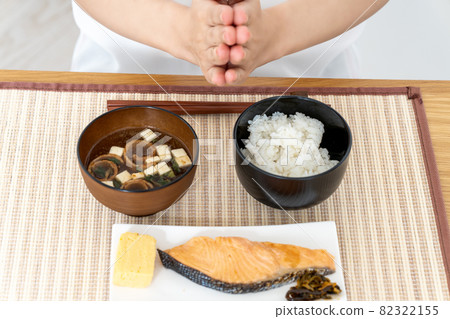 Woman eating Japanese food for breakfast [Parts cut] 82322155