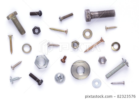 Set of old metal screw, bolt head, nut, washer and nail tool at white background Set of old metal screw, bolt head, nut, washer and nail tool at white background 82323576