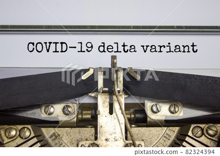 Covid-19 delta virus variant symbol. Words 'Covid-19 delta variant' typed on retro typewriter. Medical and COVID-19 new delta plus variant concept. Covid-19 delta virus variant symbol. Words 'Covid-19 delta variant' typed on retro typewriter. Medical and COVID-19 new delta plus variant concept. 82324394