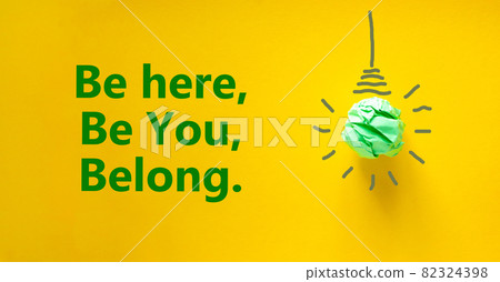 You belong here symbol. Green shining light bulb icon. Words Be here, be you, belong. Beautiful yellow background. Diversity, inclusion and you belong here concept. Copy space. You belong here symbol. Green shining light bulb icon. Words Be here, be you, belong. Beautiful yellow background. Diversity, inclusion and you belong here concept. Copy space. 82324398