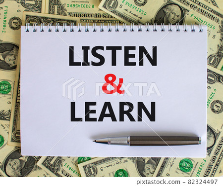 Listen and learn symbol. Words 'Listen and learn' on white note. Beautiful background from dollar bills, metallic pen. Business, educational and listen and learn concept. Copy space. Listen and learn symbol. Words 'Listen and learn' on white note. Beautiful background from dollar bills, metallic pen. Business, educational and listen and learn concept. Copy space. 82324497