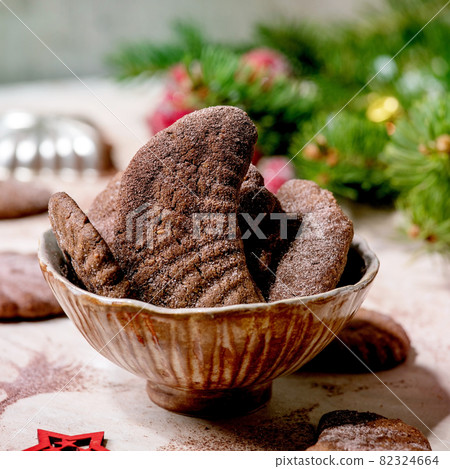Christmas shortcrust cookies chocolate crescents with fir tree, molds, xmas decorations. 82324664